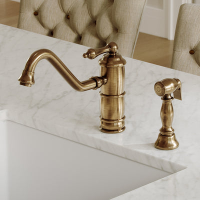Single lever faucet with traditional swivel spout and solid brass side spray