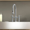 Lead-free solid stainless steel bridge faucet with a gooseneck swivel spout and pull-down spray head