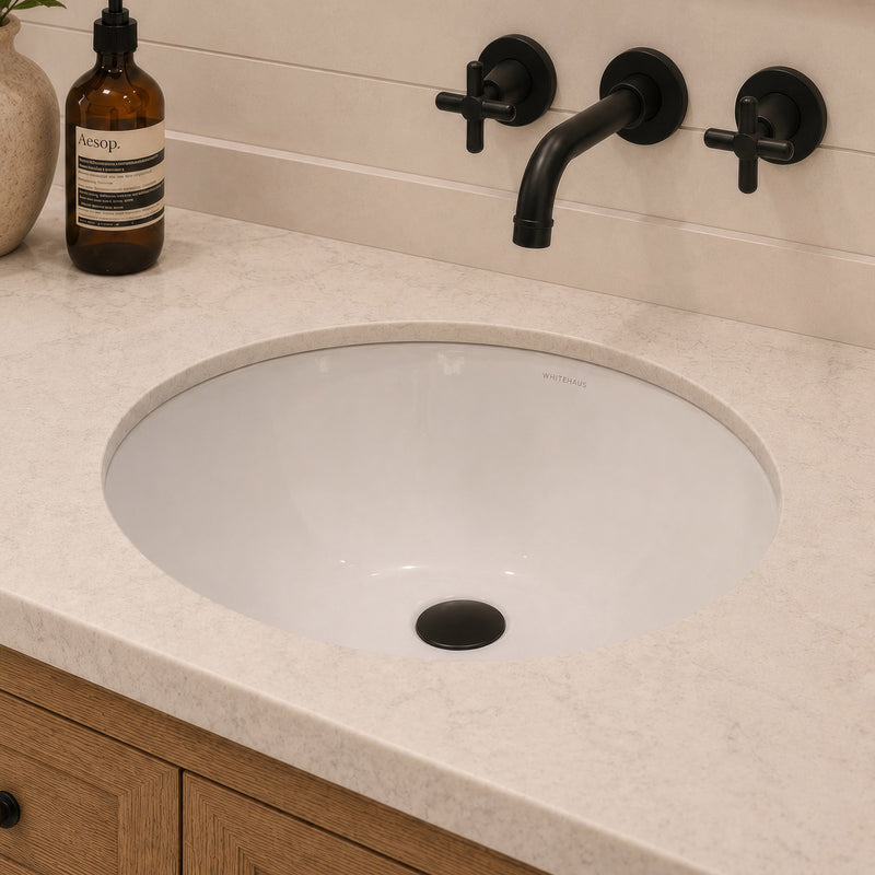 Oval undermount basin with overflow and rear center drain location